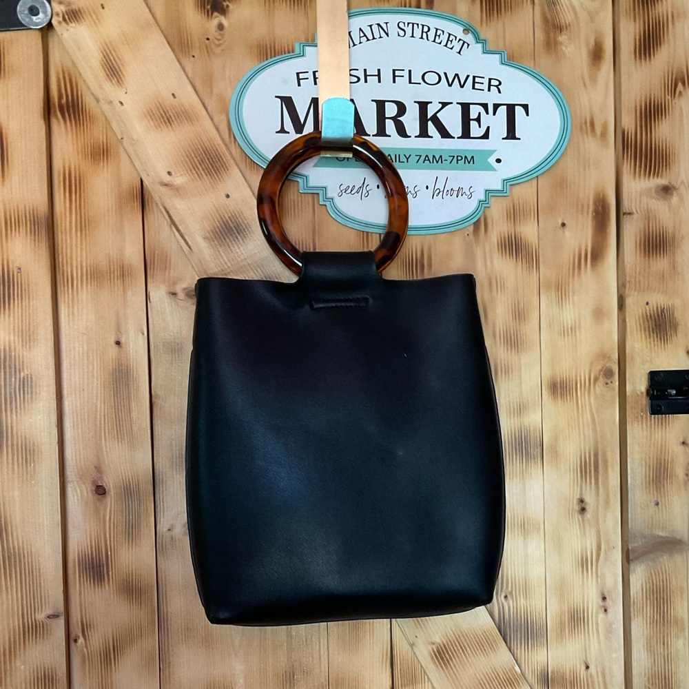 Black bag can also be used as a crossbody